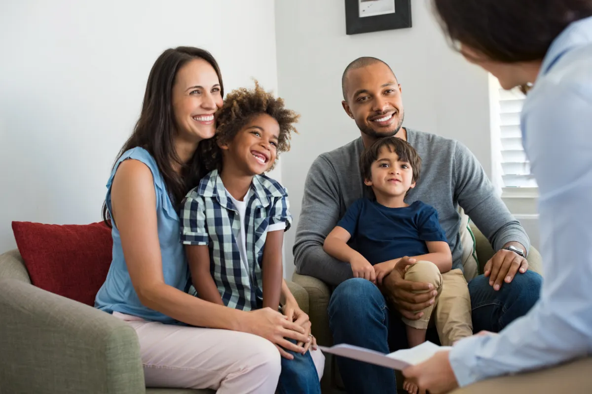 Family talking with a Boston-based immigration lawyer at FitzGerald Law Company about how to obtain a family-based green card
